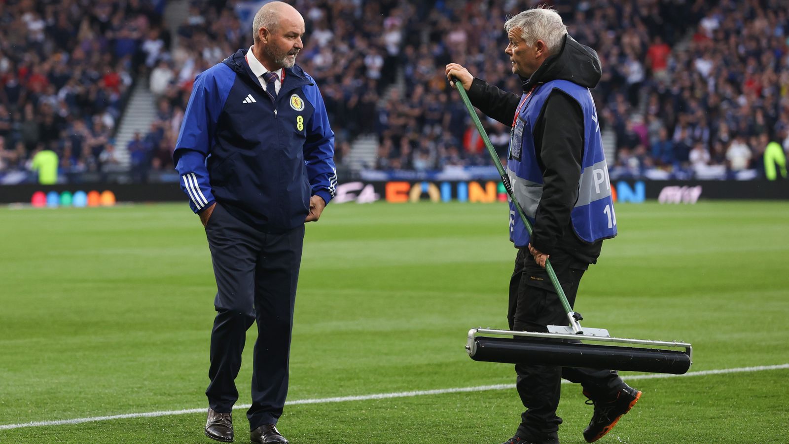 Scotland Fans Triumph Over Rain Delay as Steve Clarke Earns Commendation, While UEFA Draws Criticism from Willy Sagnol